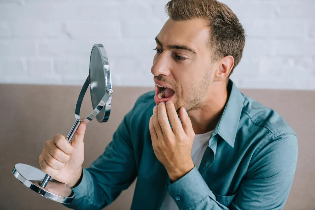 Man with Sensitivity Needing an Emergency Dentist in Charlotte