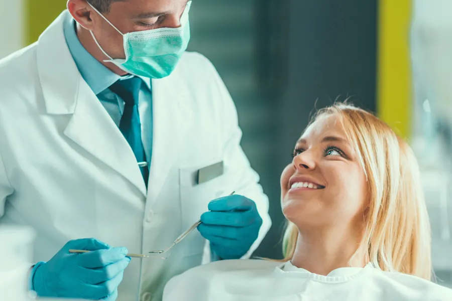 cosmetic dentist in Charlotte talking to patient
