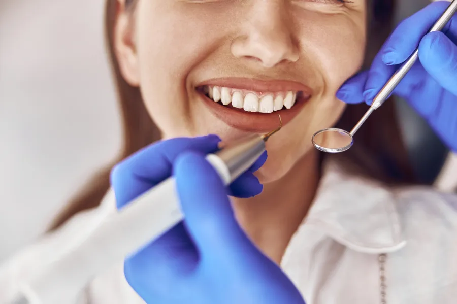 best cosmetic dentist in charlotte​ checking patient's teeth