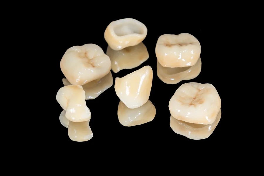 dental crowns charlotte set of porcelain crowns on black background